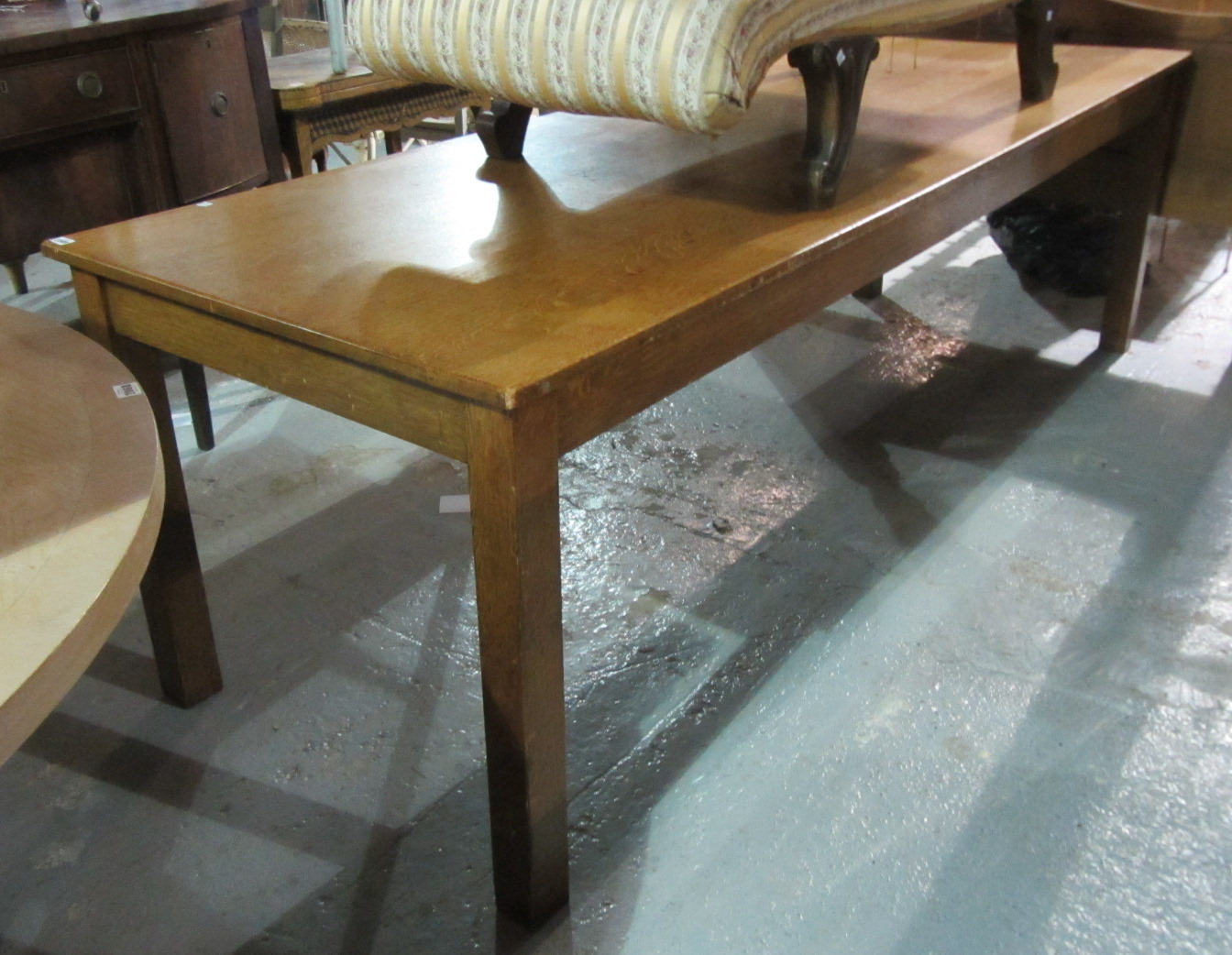 Appraisal: A th century oak rectangular dining table on square supports