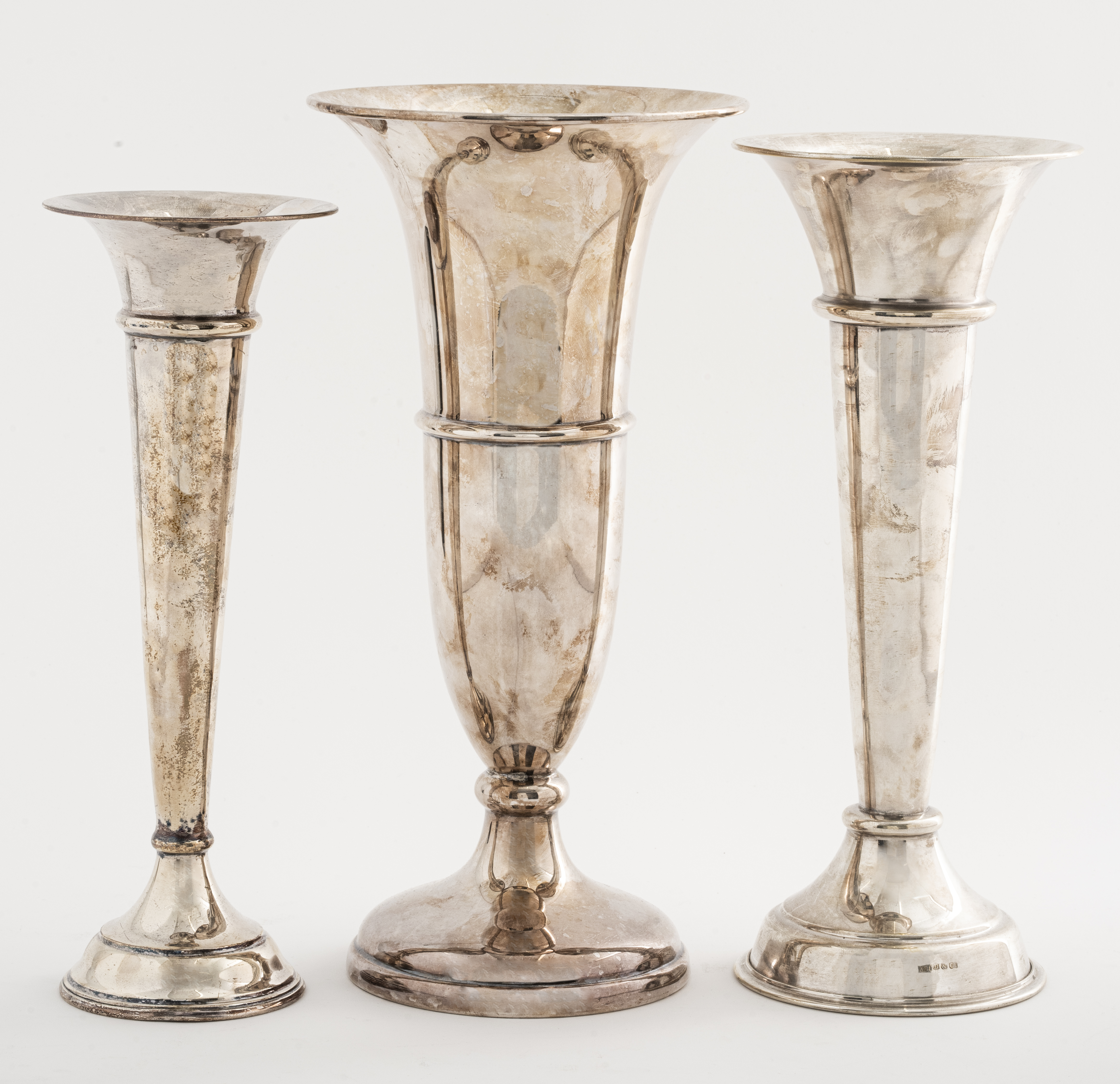 Appraisal: ASSORTED SILVER-PLATE TRUMPET VASES Three assorted silver-plate trumpet vases of