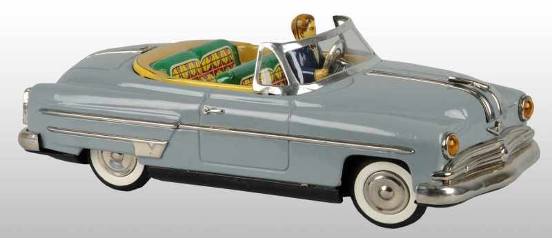 Appraisal: Tin Automobile Friction Toy Description Japanese Working Includes driver with