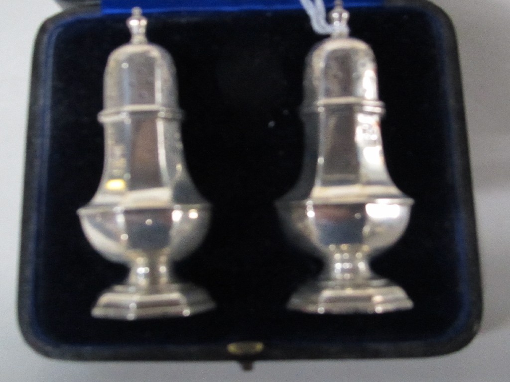 Appraisal: Cased pair of silver pepperettes Birmingham