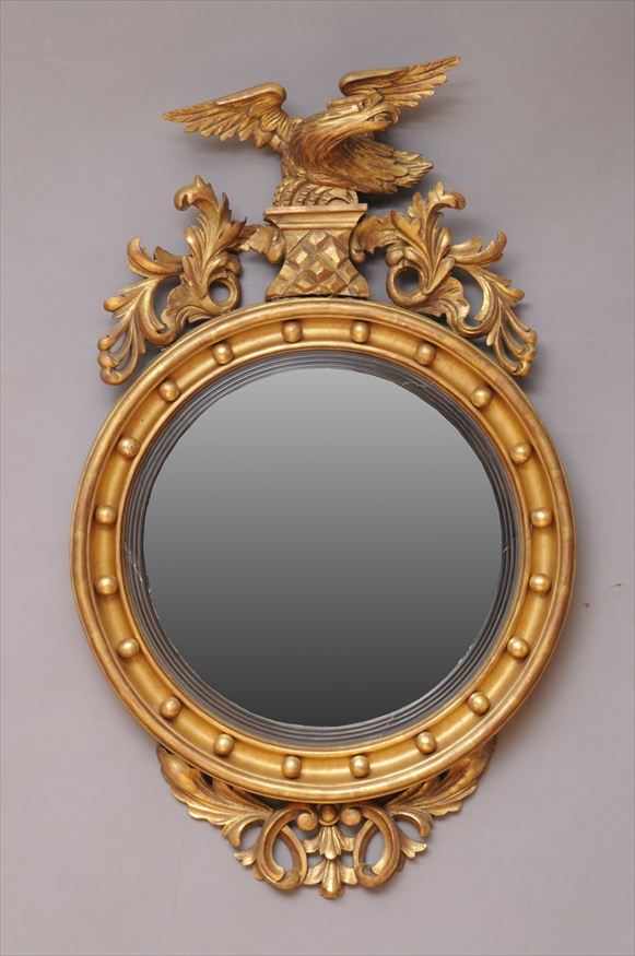 Appraisal: REGENCY CARVED GILTWOOD CONVEX MIRROR The plate with ebonized reeded