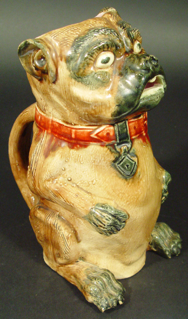 Appraisal: Continental Majolica novelty water jug modelled as a dog decorated