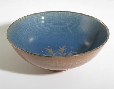 Appraisal: A Wedgwood earthenware bowl by Norman Wilson on shallow foot