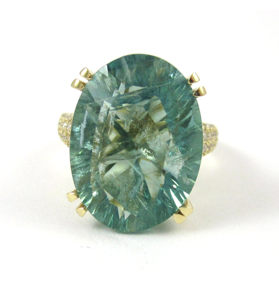 Appraisal: GREEN FLUORITE AND FOURTEEN KARAT GOLD RING with round-cut diamonds