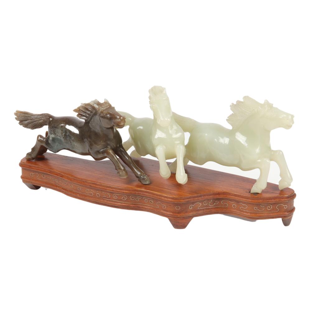 Appraisal: CHINESE CARVED JADE GALLOPING HORSE FIGURE GROUP ON STAND H