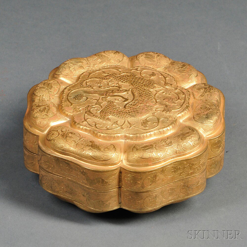 Appraisal: Repousse Gilt-metal Covered Lobed Box China with a central qilin