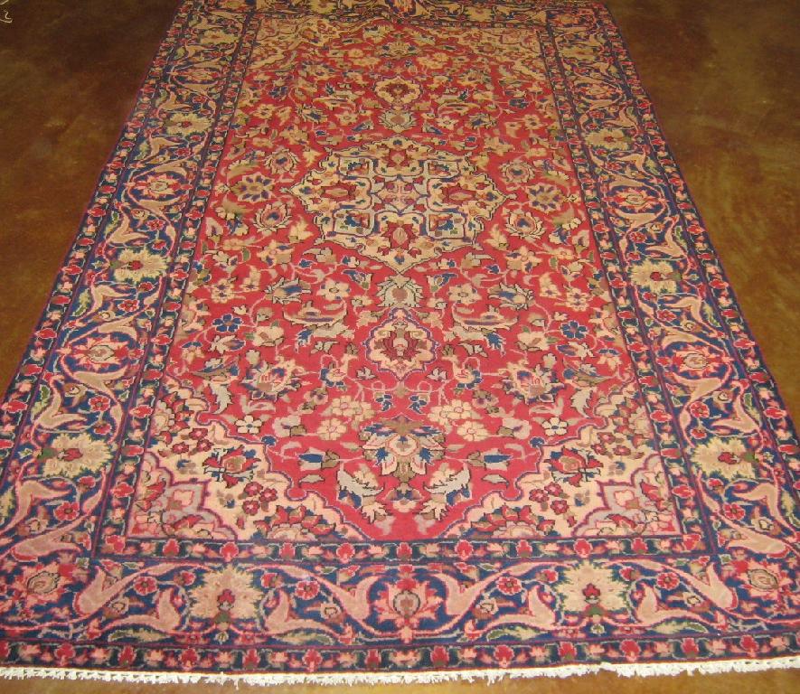 Appraisal: A Persian Rug with leafage design on red and blue