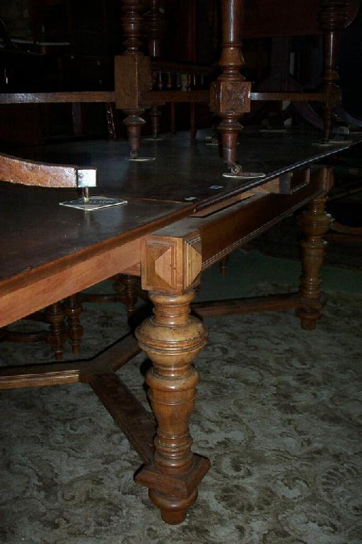 Appraisal: A late th century continental walnut extending dining table when