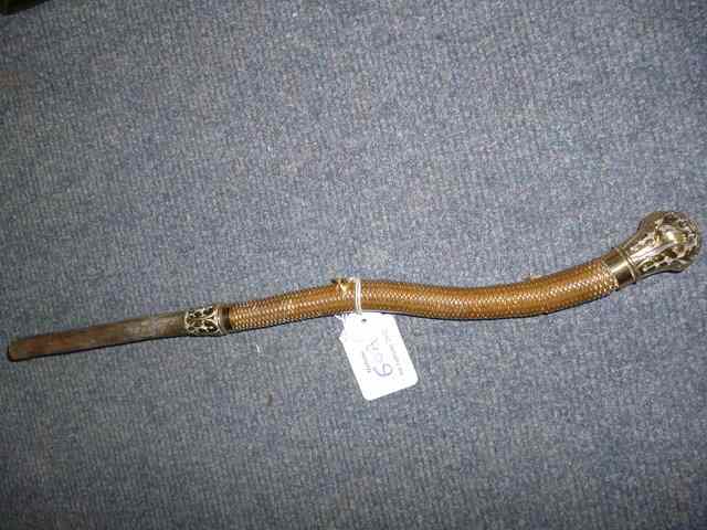 Appraisal: A GILT METAL MOUNTED WHIP HANDLE by Swaine Isaac of