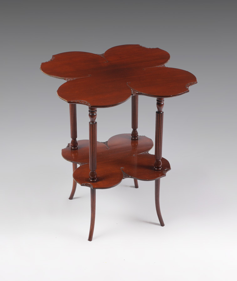 Appraisal: MAHOGANY CLOVER LEAF TWO TIER OCCASIONAL TABLE Clover leaf shaped