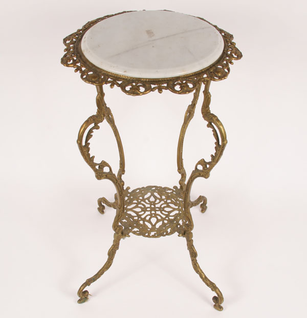 Appraisal: Ornate cast brass stand curved legs pierce work lower stretcher