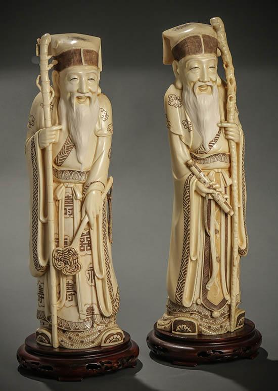 Appraisal: Pair of Chinese Sepia Decorated Scrimshaw Ivory Figures of Immortals