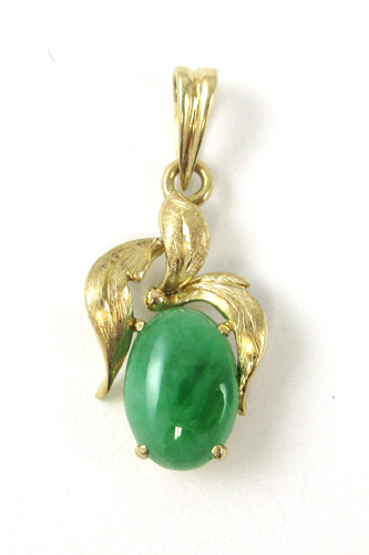 Appraisal: JADE AND FOURTEEN KARAT GOLD PENDANT set with an oval