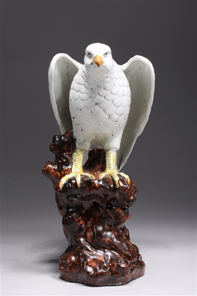 Appraisal: Chinese porcelain hawk atop rock formation statue overall good condition