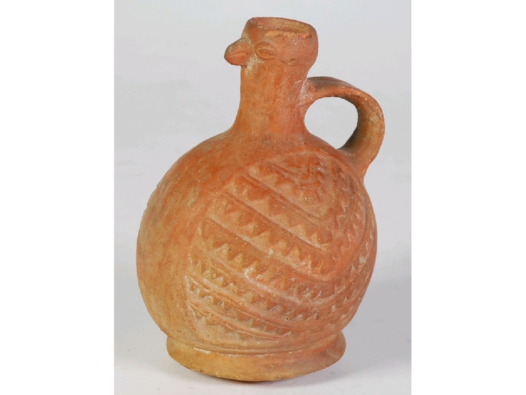 Appraisal: SOUTH AMERICAN PRE-COLUMBIAN TERRACOTTA JUG with opposing moulded panels of