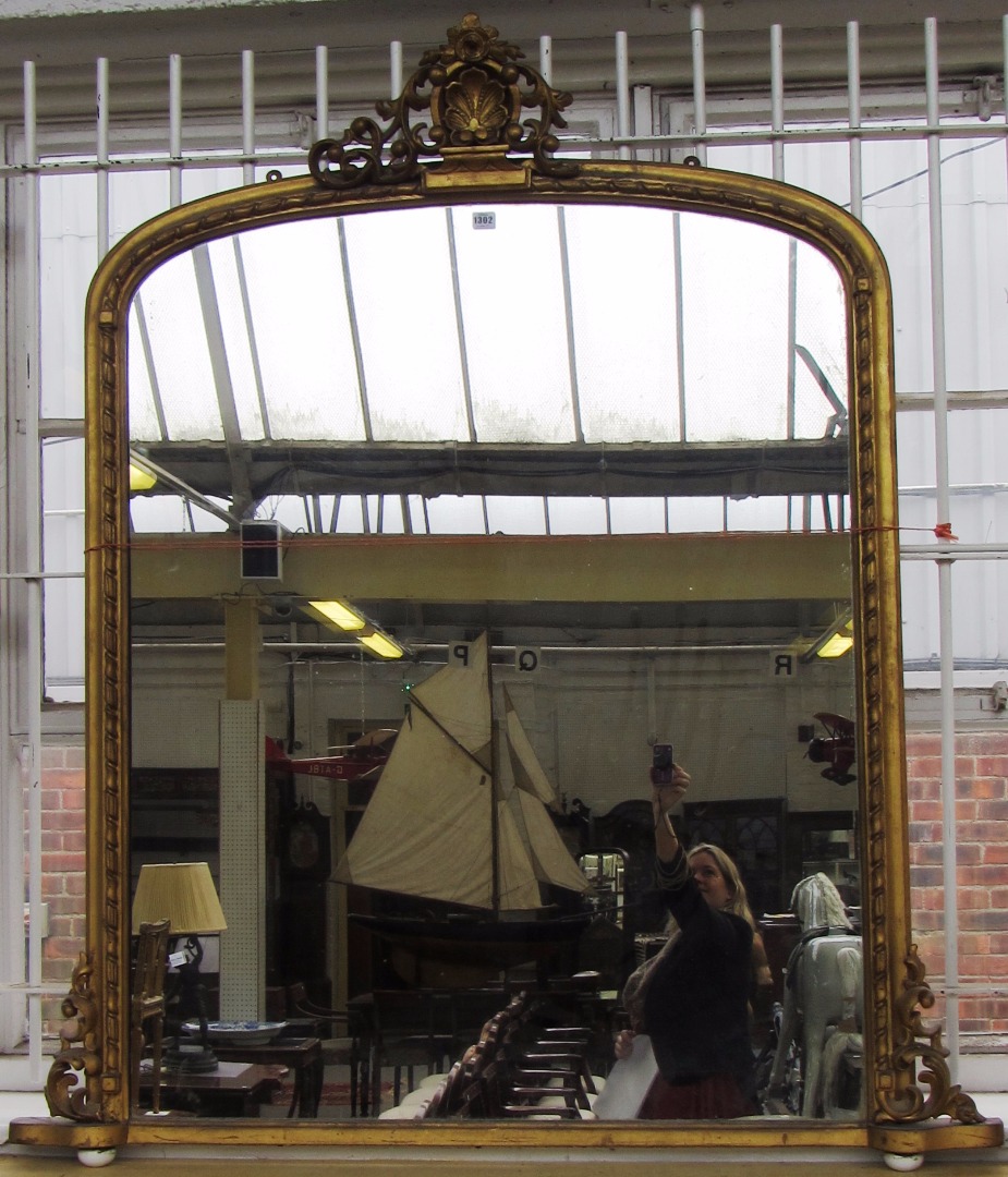 Appraisal: A Victorian gilt framed arch top overmantel mirror with acanthus