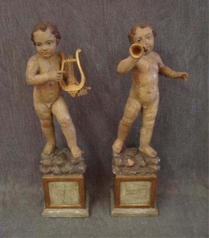 Appraisal: Two - th Cent high polychrome putti figures w glass