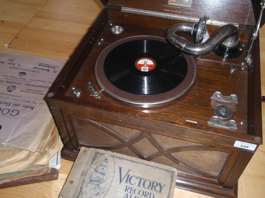 Appraisal: An oak-cased HMV cabinet gramophone and records