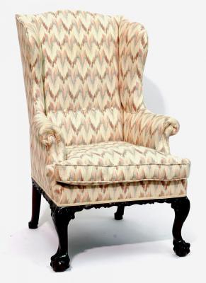 Appraisal: A MAHOGANY FRAMED WING ARMCHAIR upholstered in a modern tapestry