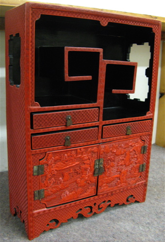 Appraisal: MINIATURE RED CINNABAR DISPLAY CABINET Chinese th century The upper