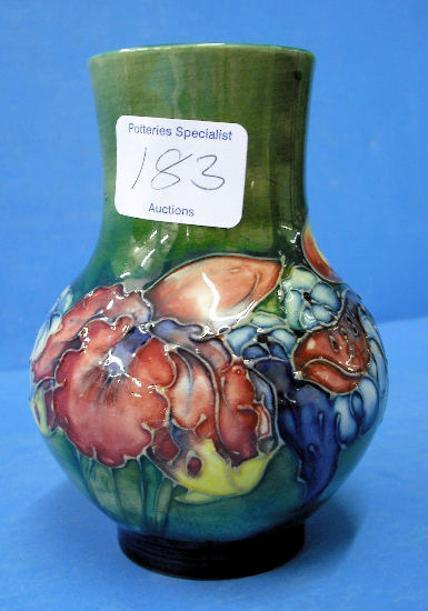 Appraisal: Moorcroft Vase decorated in the Orchid design on green ground