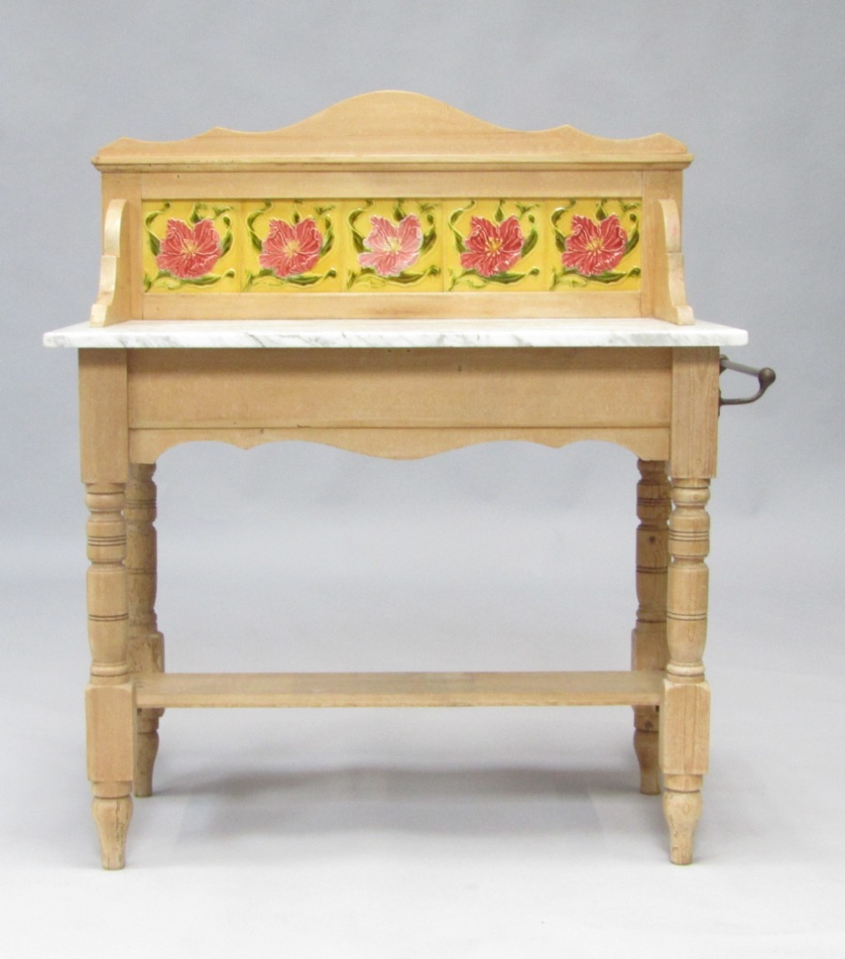 Appraisal: A Victorian pine washstand with floral tiled splash back and