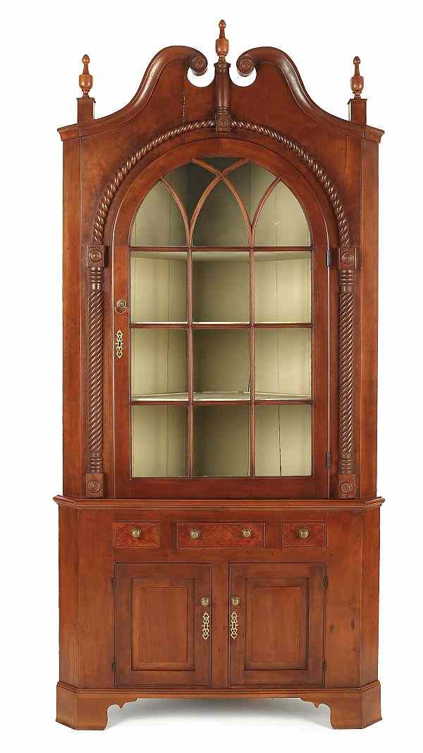 Appraisal: Pennsylvania Federal cherry corner cupboard ca in two parts with