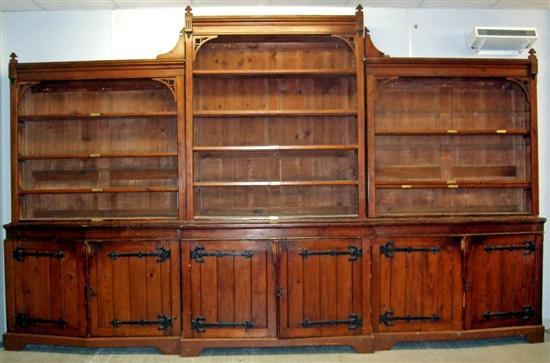 Appraisal: Victorian Gothic pine triple breakfront library bookcase on a plinth