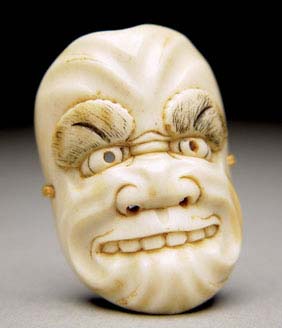 Appraisal: ANTIQUE BONE MASK NETSUKE Antique carved and bleached bone with