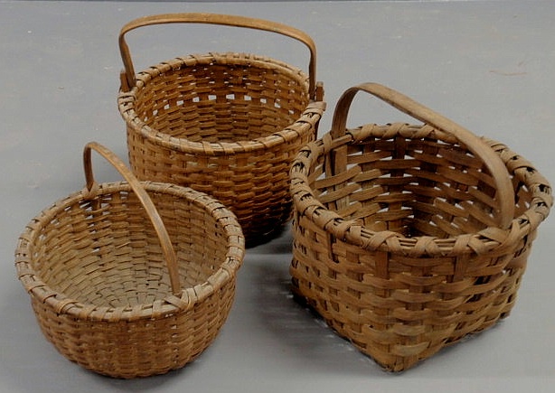 Appraisal: Three splintwood gathering baskets probably th c round basket tallest