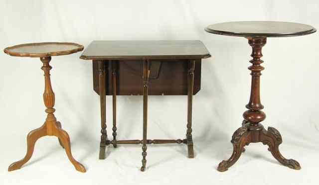 Appraisal: A Victorian walnut occasional table on carved tripod base cm