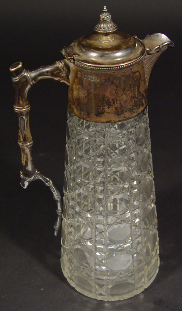 Appraisal: Victorian silver mounted cut glass claret jug with simulated bamboo