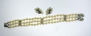 Appraisal: k white gold pearl and diamond three strand pearl bracelet