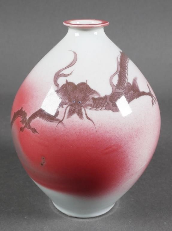 Appraisal: Japanese pink and white glazed ceramic vase with dragon design