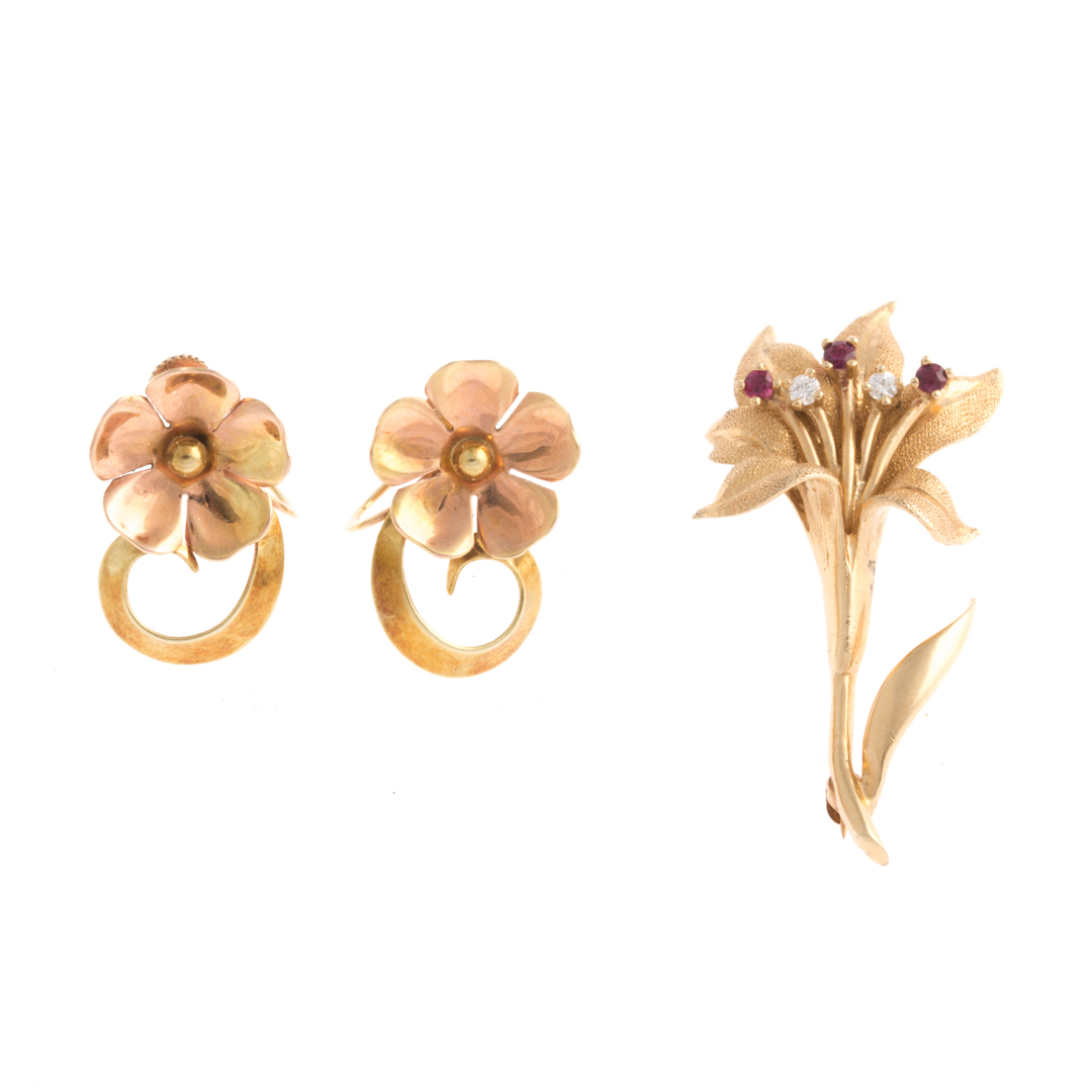 Appraisal: An Iris Brooch and Floral Ear Clips in K Gold