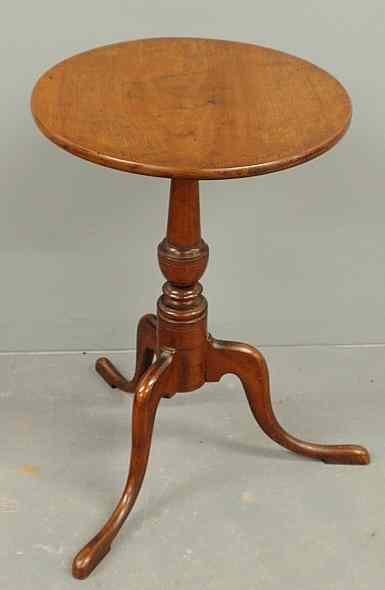 Appraisal: Cherry candlestand c with an oval top urn turned shaft