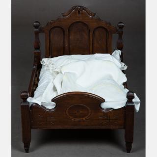 Appraisal: A Carved Walnut Doll's Bed th th Century A Carved