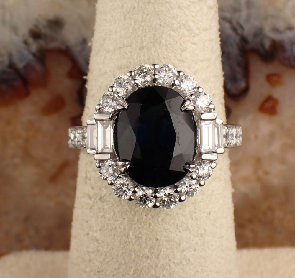 Appraisal: BLUE SAPPHIRE DIAMONDS AND EIGHTEEN KARAT WHITE GOLD RING WITH