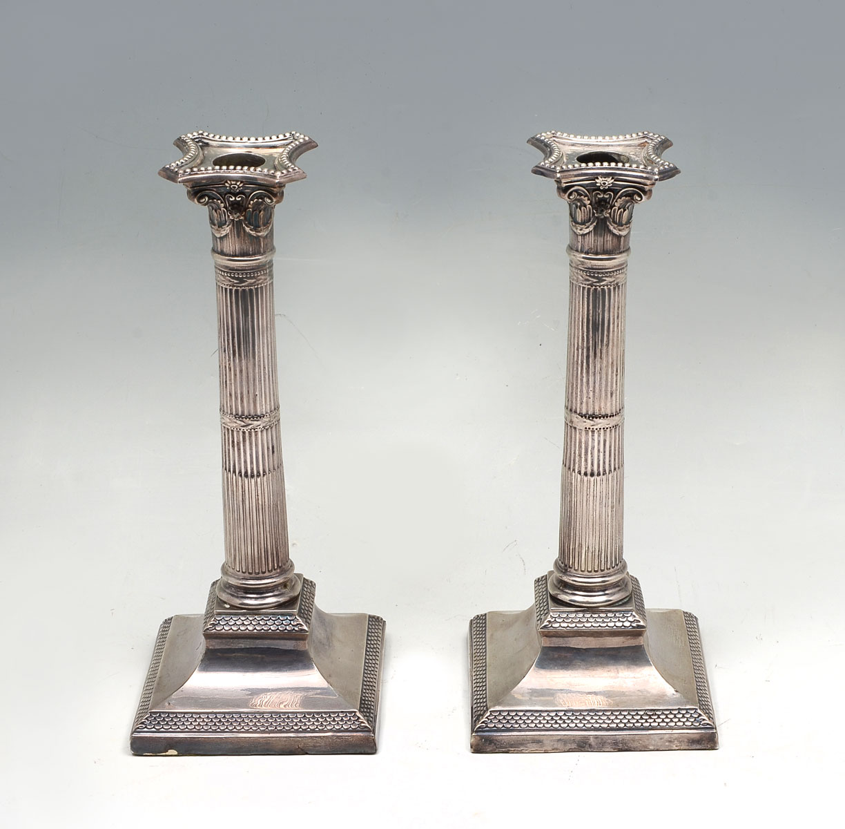 Appraisal: PAIR STERLING SILVER ENGLISH WEIGHTED COLUMNAR CANDLESTICKS Corinthian column English