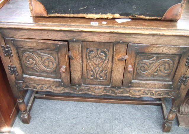 Appraisal: A mid th century oak sideboard the rectangular top over