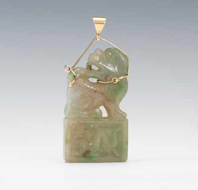 Appraisal: A Carved Jade Foo Dog Pendant in K Gold Unmarked