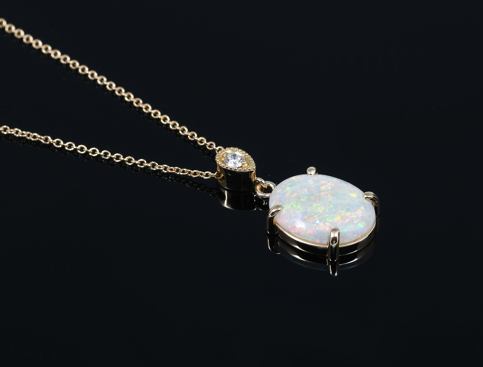 Appraisal: K CT OPAL DIAMOND PENDANT ON K CHAIN K yellow