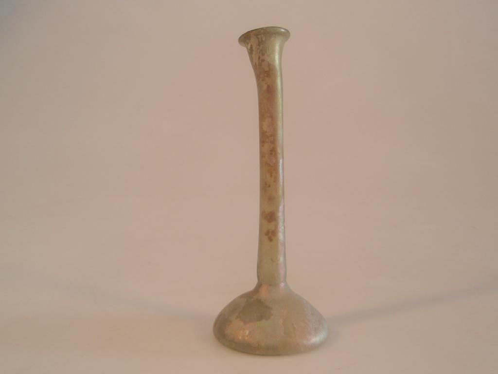 Appraisal: A Roman light green glass 'candlestick' unguentarium the irregular everted