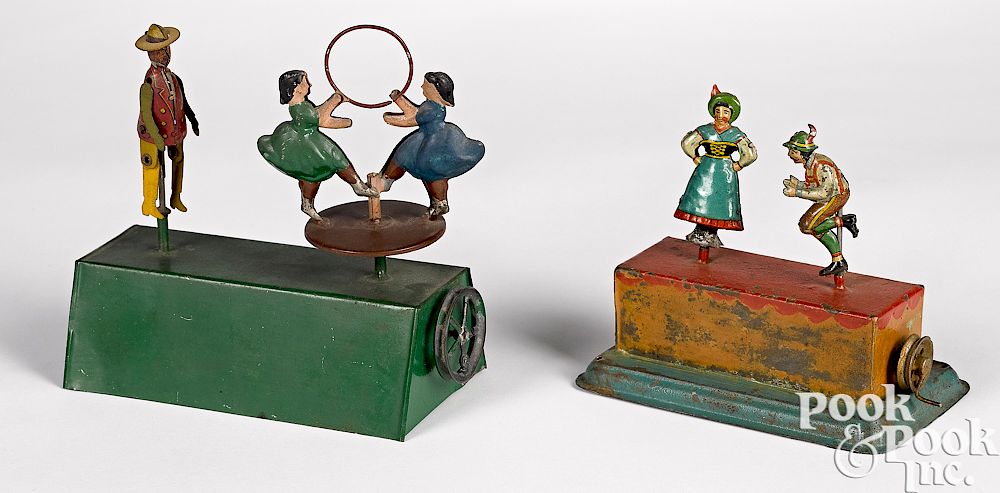 Appraisal: Two dancer steam toy accessories Two painted and lithograph tin