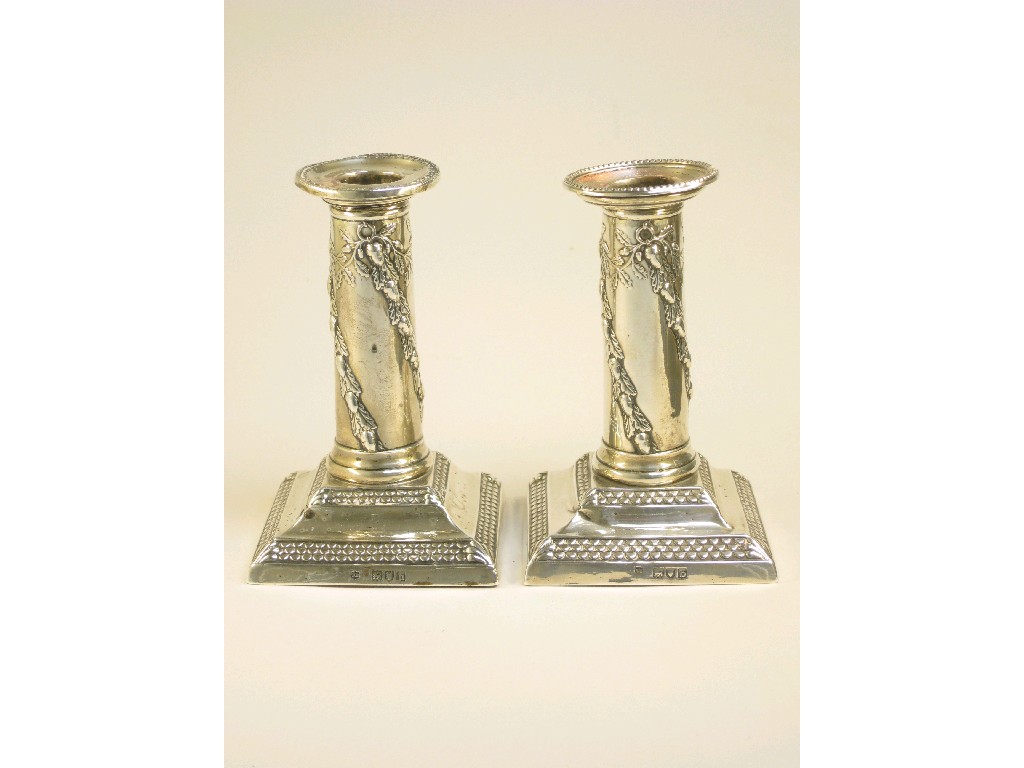 Appraisal: Pair of Victorian Candlesticks with spiral leafage stems on beaded