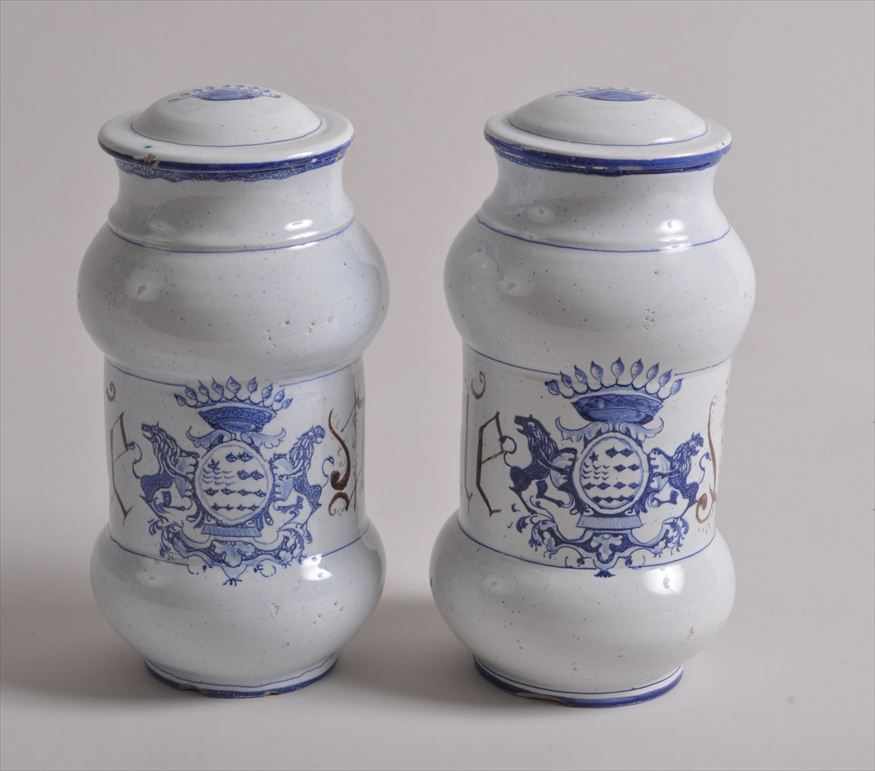 Appraisal: PAIR OF ITALIAN MAIOLICA BLUE AND WHITE ARMORIAL PHARMACY JARS