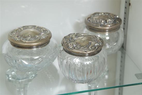 Appraisal: THREE STERLING TOP GLASS DRESSER JARS Each with art nouveau