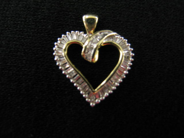 Appraisal: Diamond Heart Pendant round baguette diamonds totaling carat in k