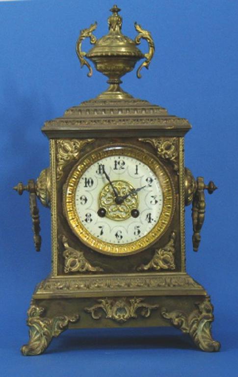 Appraisal: A TH CENTURY BRASS CASED MANTEL CLOCK with a circular