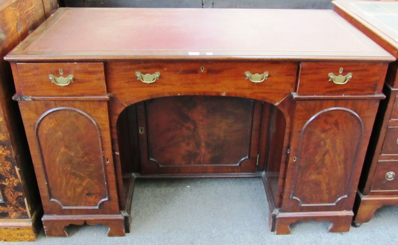 Appraisal: A Victorian mahogany pedestal desk with three frieze drawers over